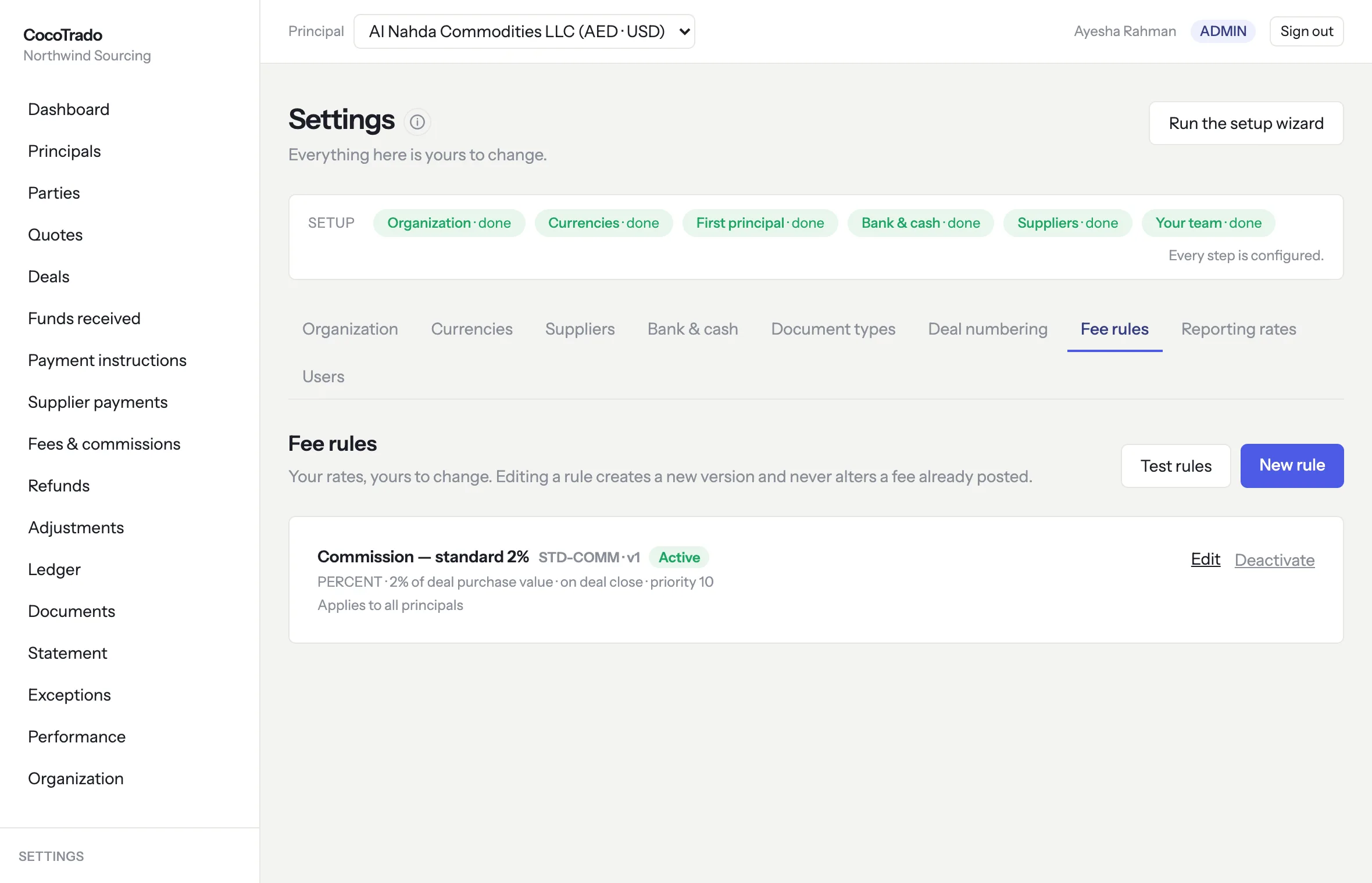Fee rules settings: one active rule — Commission, standard 2% of deal purchase value on deal close, version 1 — with Test rules and New rule controls