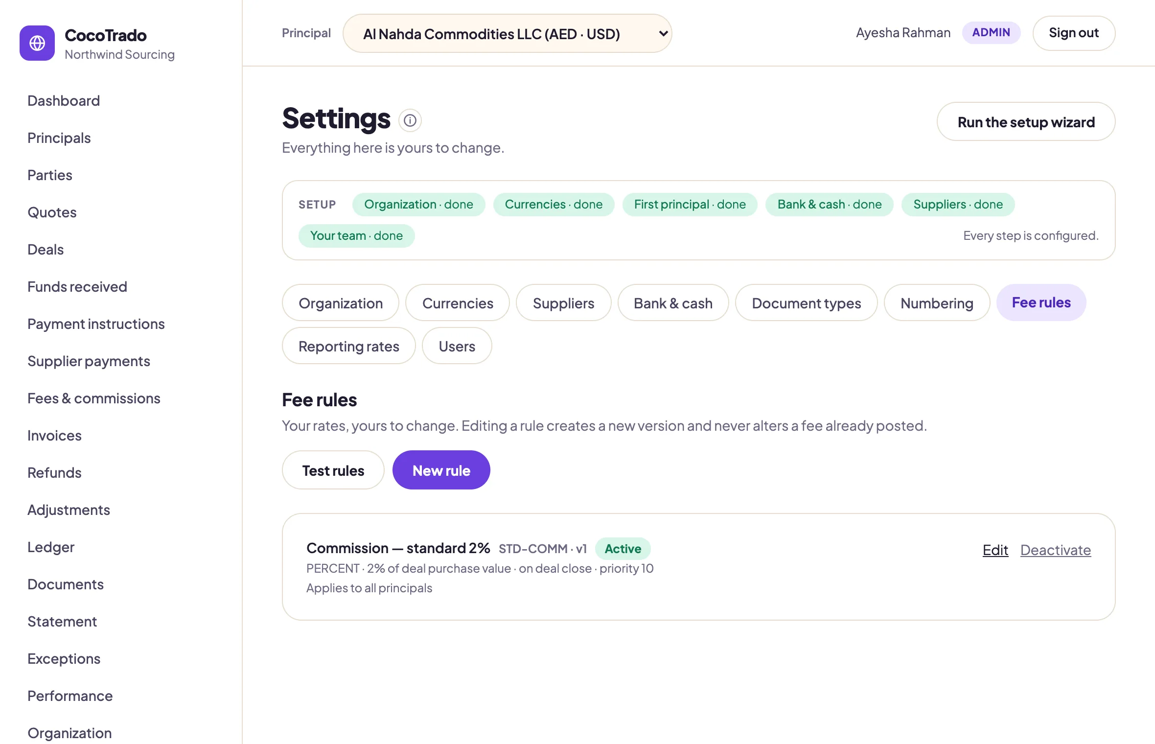 Fee rules settings: one active rule — Commission, standard 2% of deal purchase value on deal close, version 1 — with Test rules and New rule controls